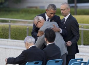 U.S. President Barack Obama hugs Shigeaki Mori, an atomic bomb survivor; creator of the memorial for American WWII POWs killed at Hiroshima, during a ceremony at Hiroshima Peace Memorial Park in Hiroshima, western Japan, Friday, May 27, 2016. Obama on Friday became the first sitting U.S. president to visit the site of the world's first atomic bomb attack, bringing global attention both to survivors and to his unfulfilled vision of a world without nuclear weapons. (ANSA/AP Photo Carolyn Kaster) [CopyrightNotice: Copyright 2016 The Associated Press. All rights reserved. This material may not be published, broadcast, rewritten or redistribu]