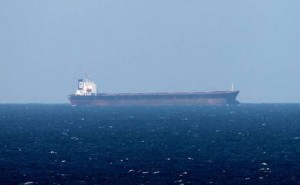 epa03060774 An Oil tanker is seen in the Strait of Hormuz from Khasab, Oman on 15 January 2012. Tehran has warned oil-producing Arab countries in the Persian Gulf against replacing Iranian oil if Western sanctions against it are implemented, a newspaper reported 15 January. Iranian generals have warned of possibly closing the Strait of Hormuz, a vital international oil route in the Persian Gulf, and blocking a considerable share of global oil exports, if oil sanctions were imposed.  EPA/ALI HAIDER
