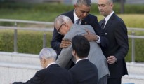 U.S. President Barack Obama hugs Shigeaki Mori, an atomic bomb survivor; creator of the memorial for American WWII POWs killed at Hiroshima, during a ceremony at Hiroshima Peace Memorial Park in Hiroshima, western Japan, Friday, May 27, 2016. Obama on Friday became the first sitting U.S. president to visit the site of the world's first atomic bomb attack, bringing global attention both to survivors and to his unfulfilled vision of a world without nuclear weapons. (ANSA/AP Photo Carolyn Kaster) [CopyrightNotice: Copyright 2016 The Associated Press. All rights reserved. This material may not be published, broadcast, rewritten or redistribu]